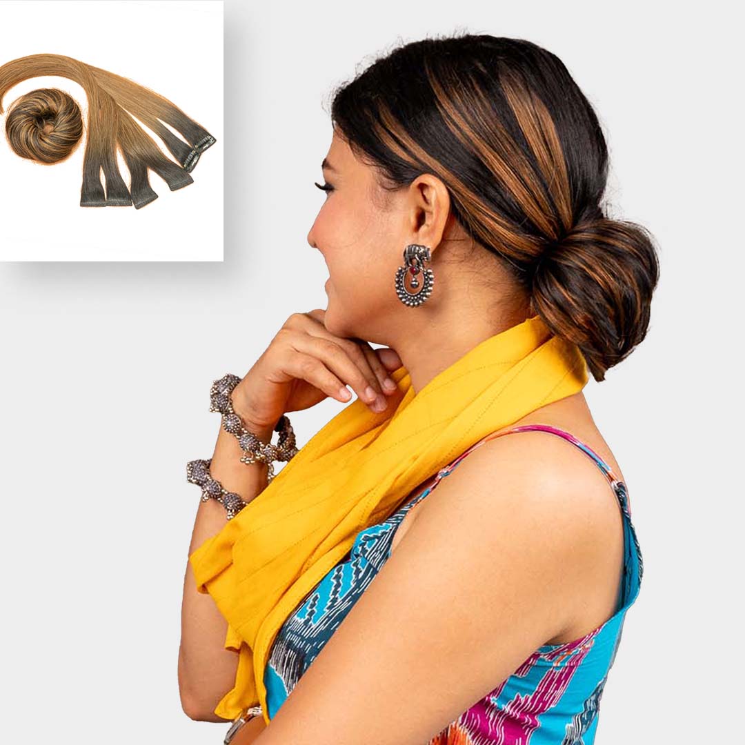 Golden brown highlights and hair bun combo