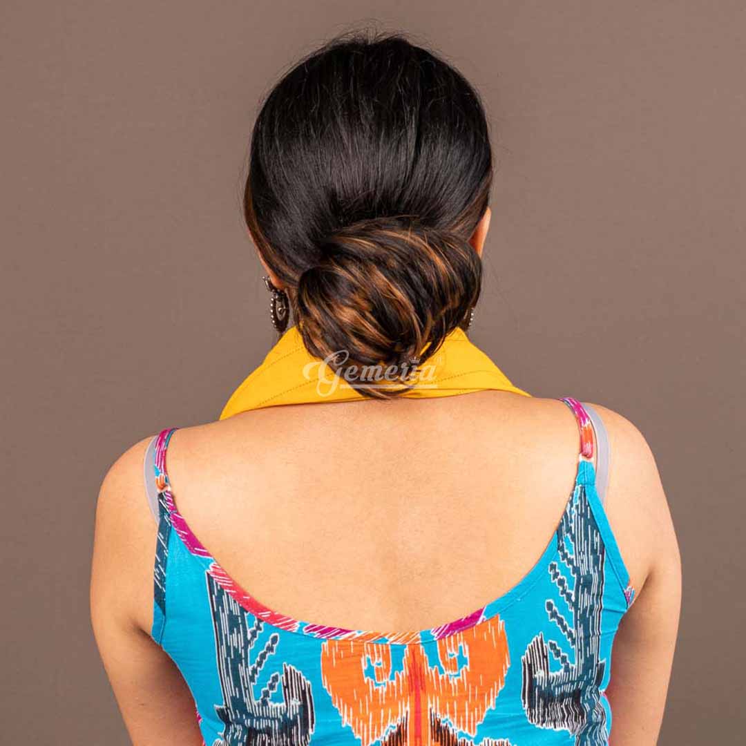 Golden brown highlights and hair bun combo