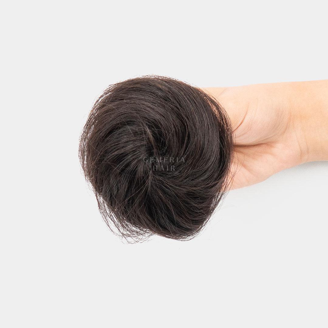 showing the front view of the clip-on hair bun product.