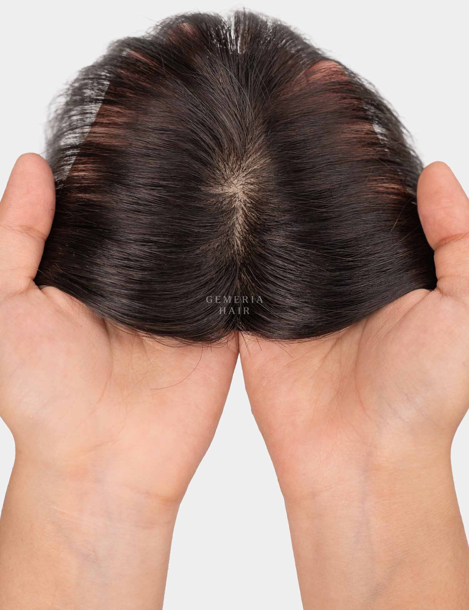 Top view of mini topper showing natural hair parting and hand-held lace base