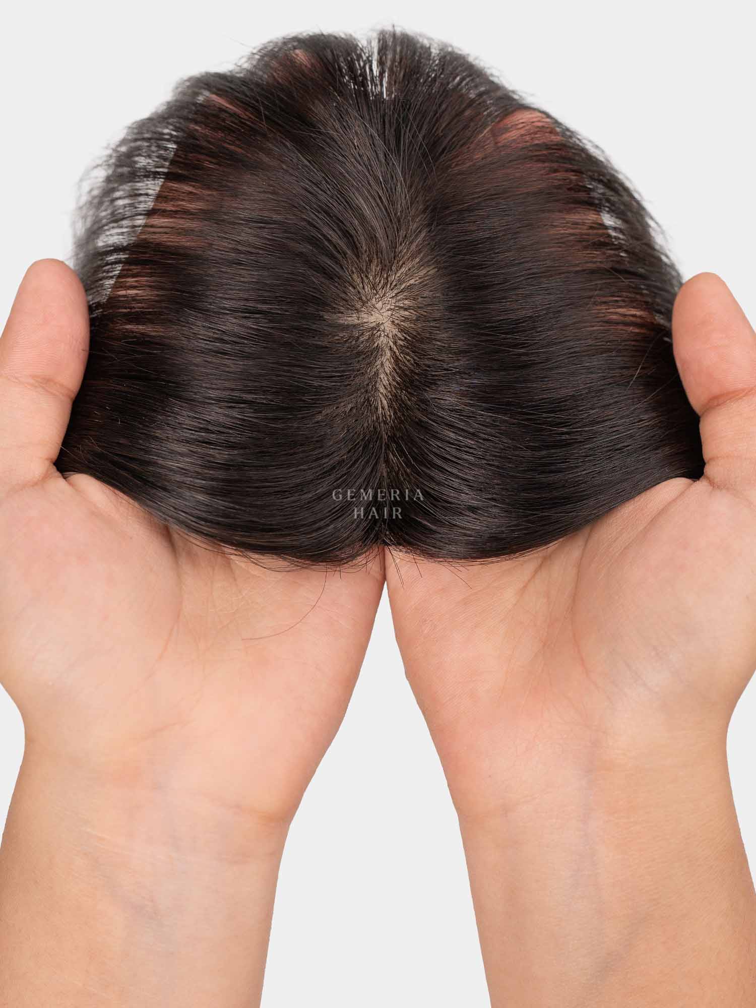 Top view of mini topper showing natural hair parting and hand-held lace base