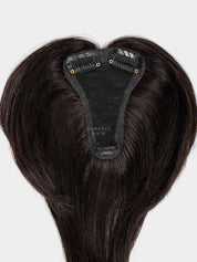 Top view of Gemeria Hair mini topper, showing shaped base
