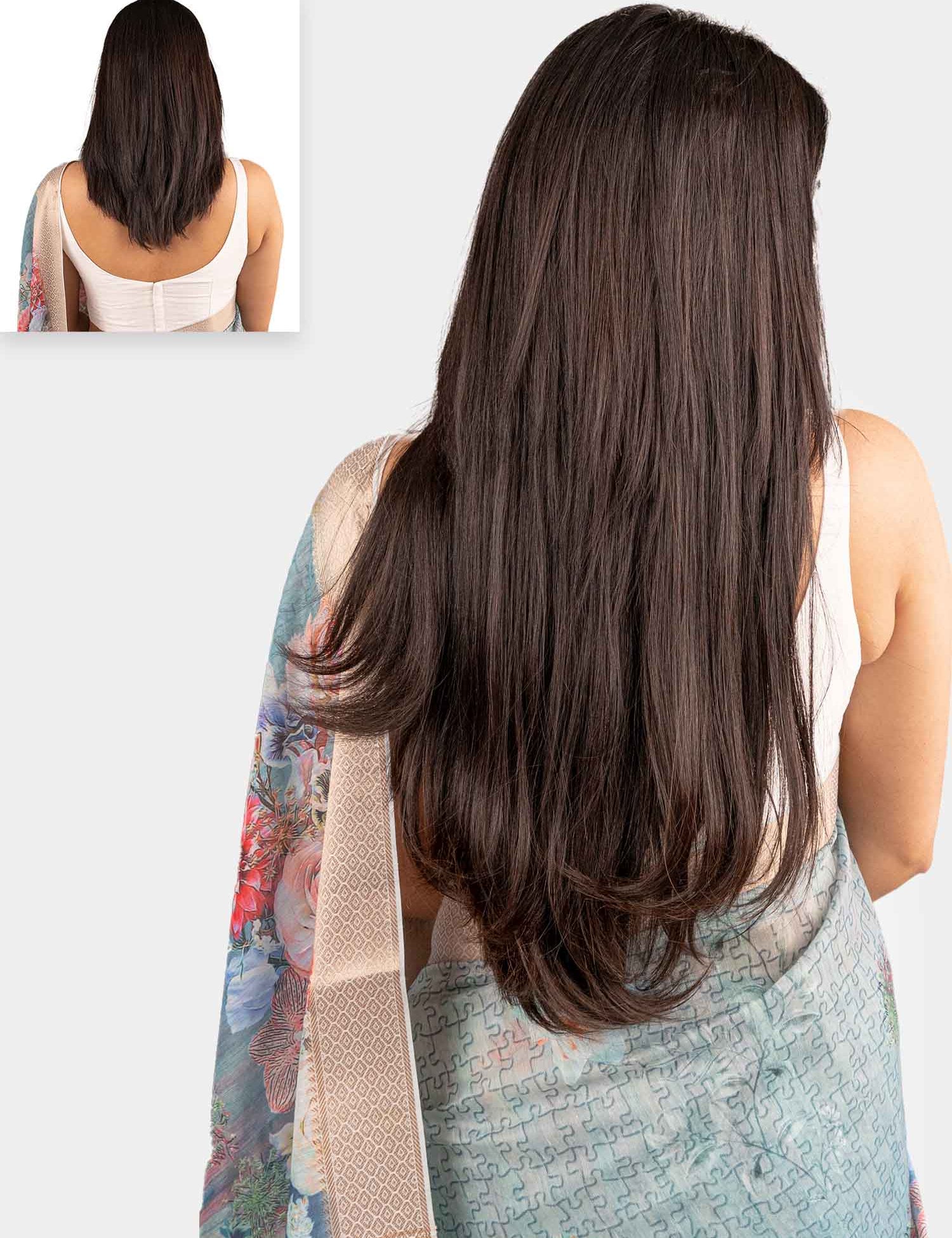 A woman with straight, long hair wearing a clip-in hair extension 7 set from the Classic Collection.
