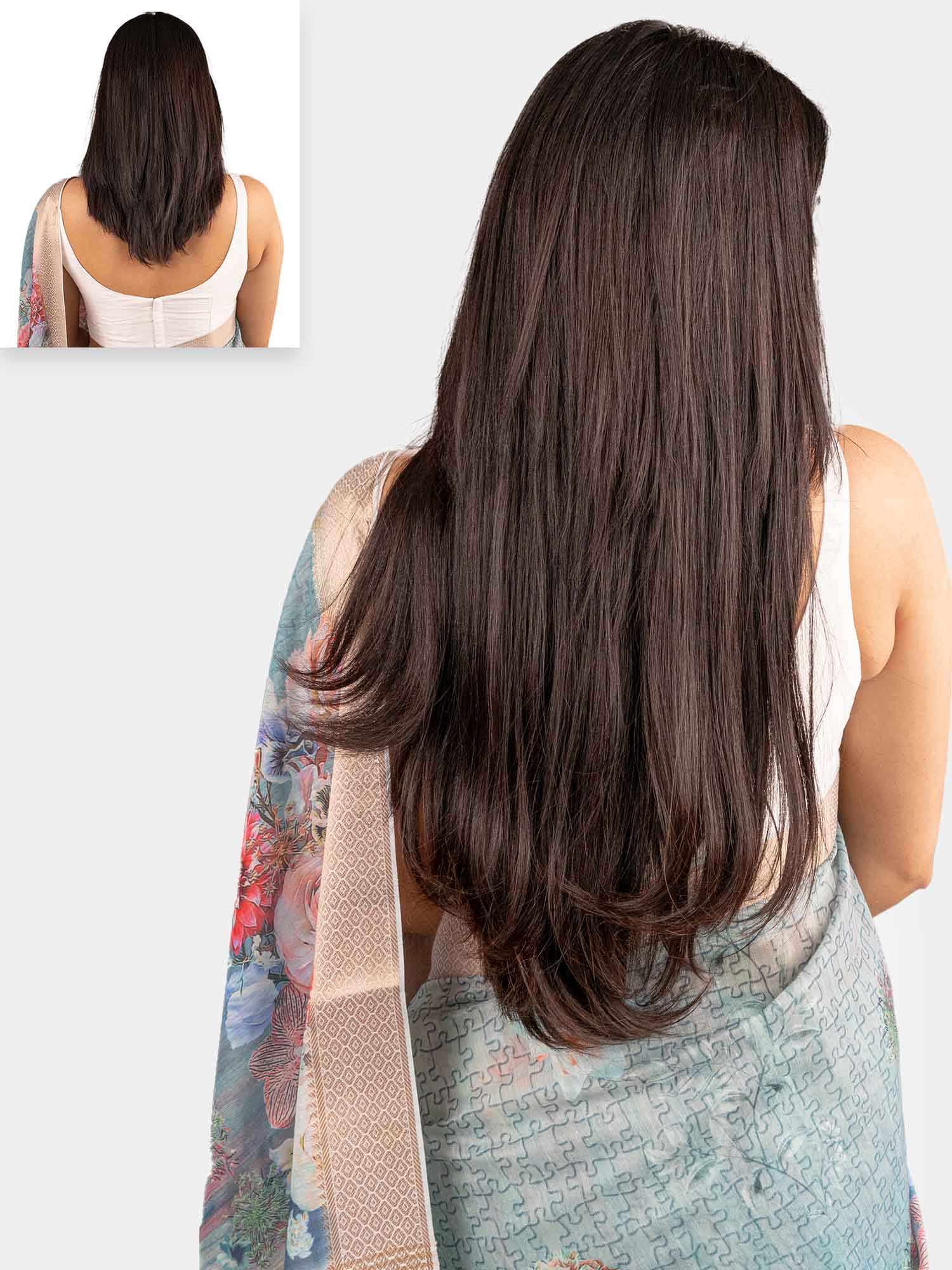 A woman with straight, long hair wearing a clip-in hair extension 7 set from the Classic Collection.