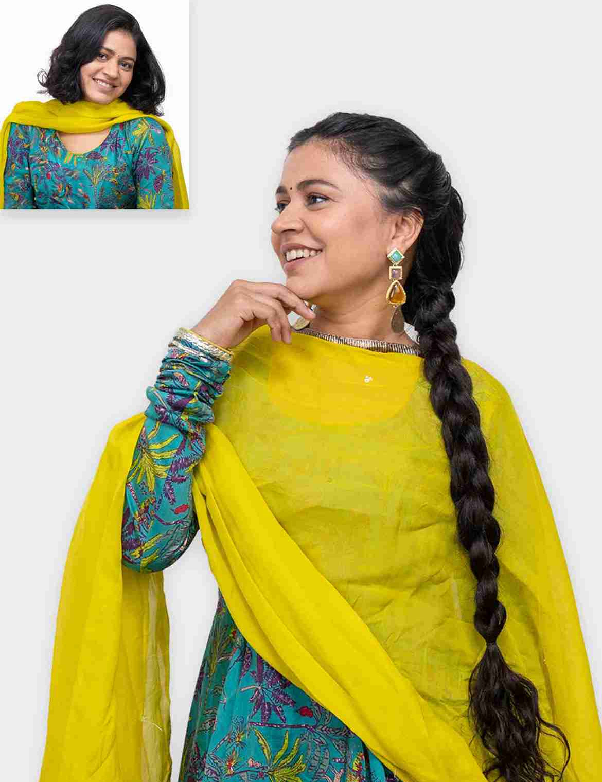 Woman wearing long braid ponytail extension styled with traditional outfit