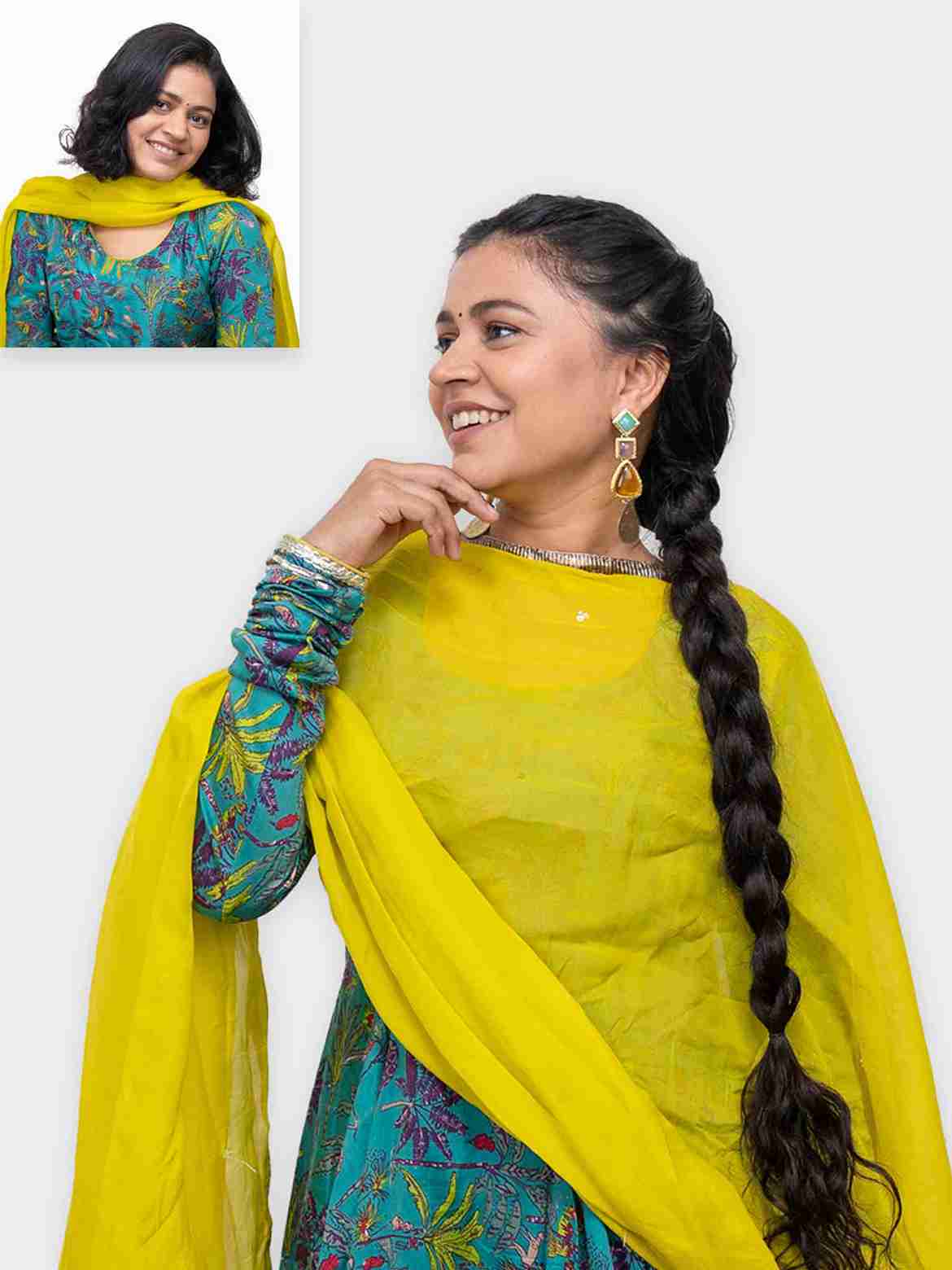 Woman wearing long braid ponytail extension styled with traditional outfit