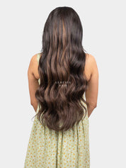 ack view of woman wearing Ash Brown Balayage Half Head Wig with long, flowing brown waves