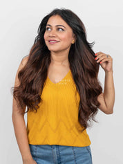 Woman styling long, wavy Barrel Brown Balayage Half Head Wig with natural-looking brown tones