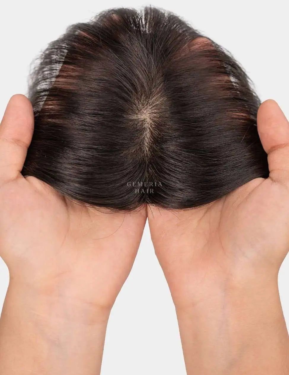 Top view of mini topper showing natural hair parting and hand-held lace base