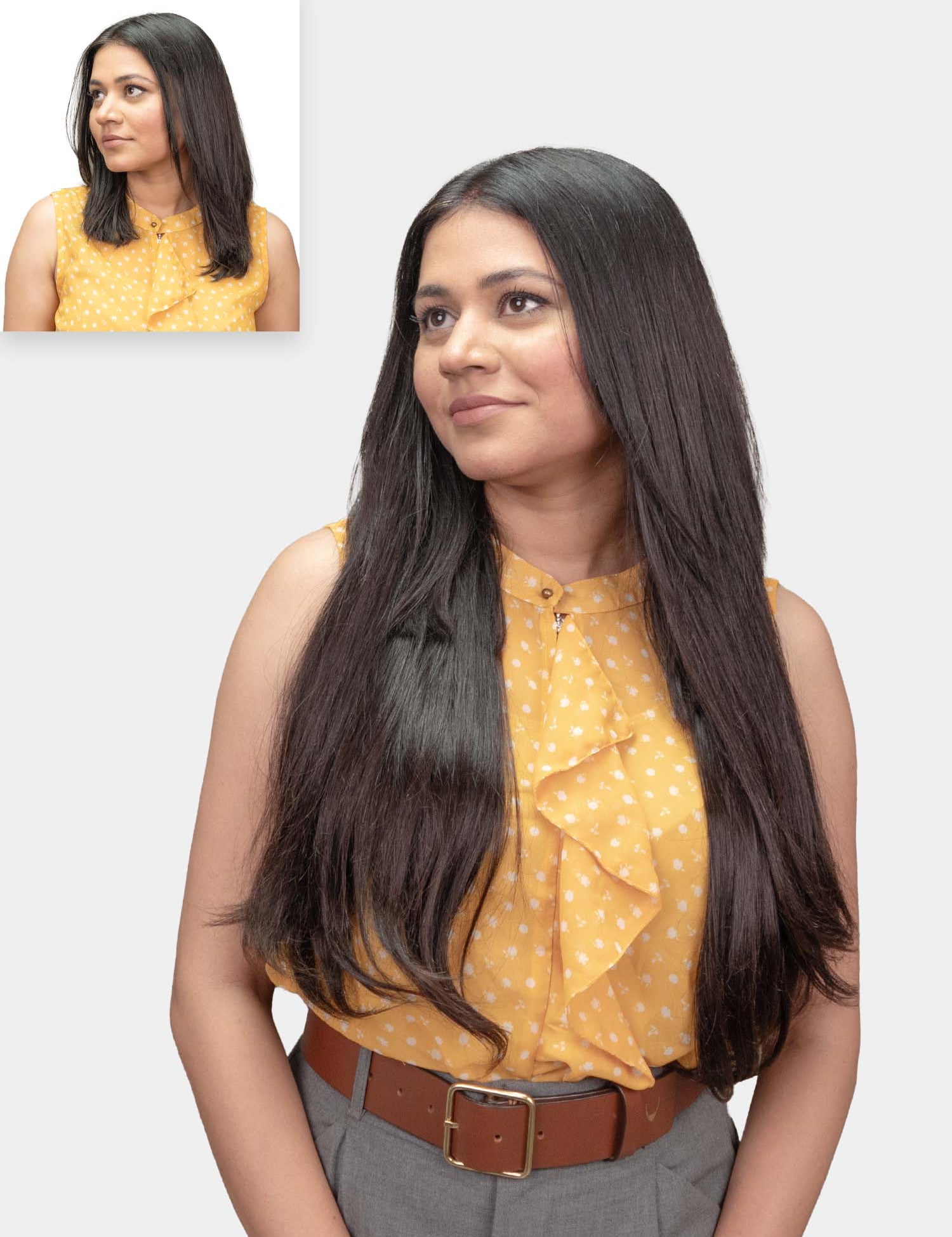 A woman with long straight hair wearing a yellow top, showcasing seamless clip-in hair extensions.