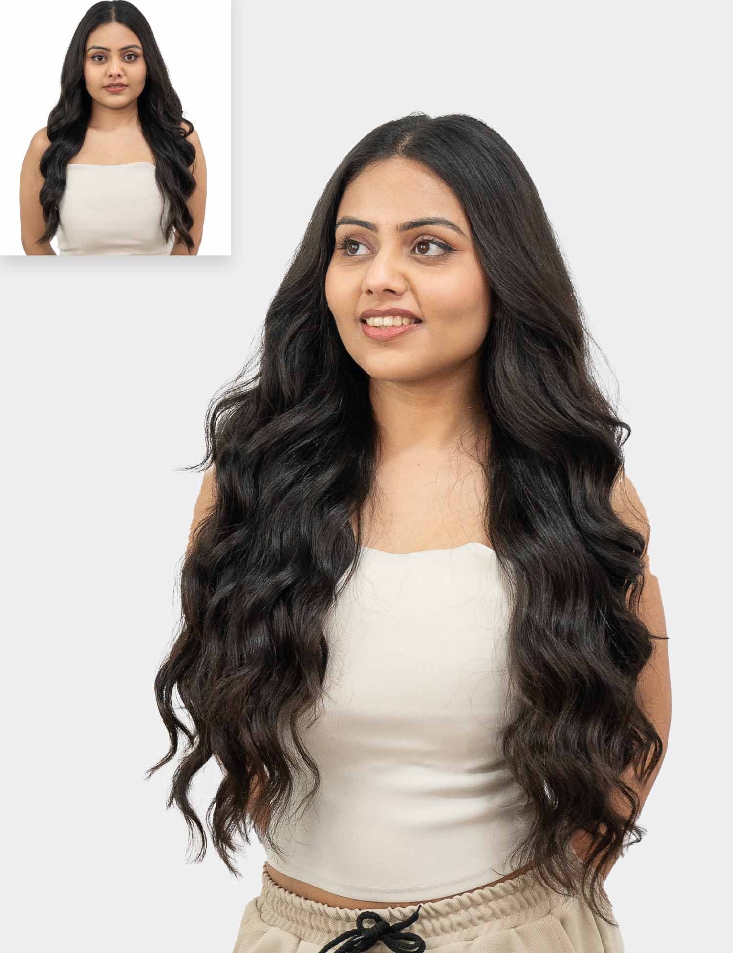 A woman with long wavy hair wearing a white top, with an inset picture showing her face with shorter hair.