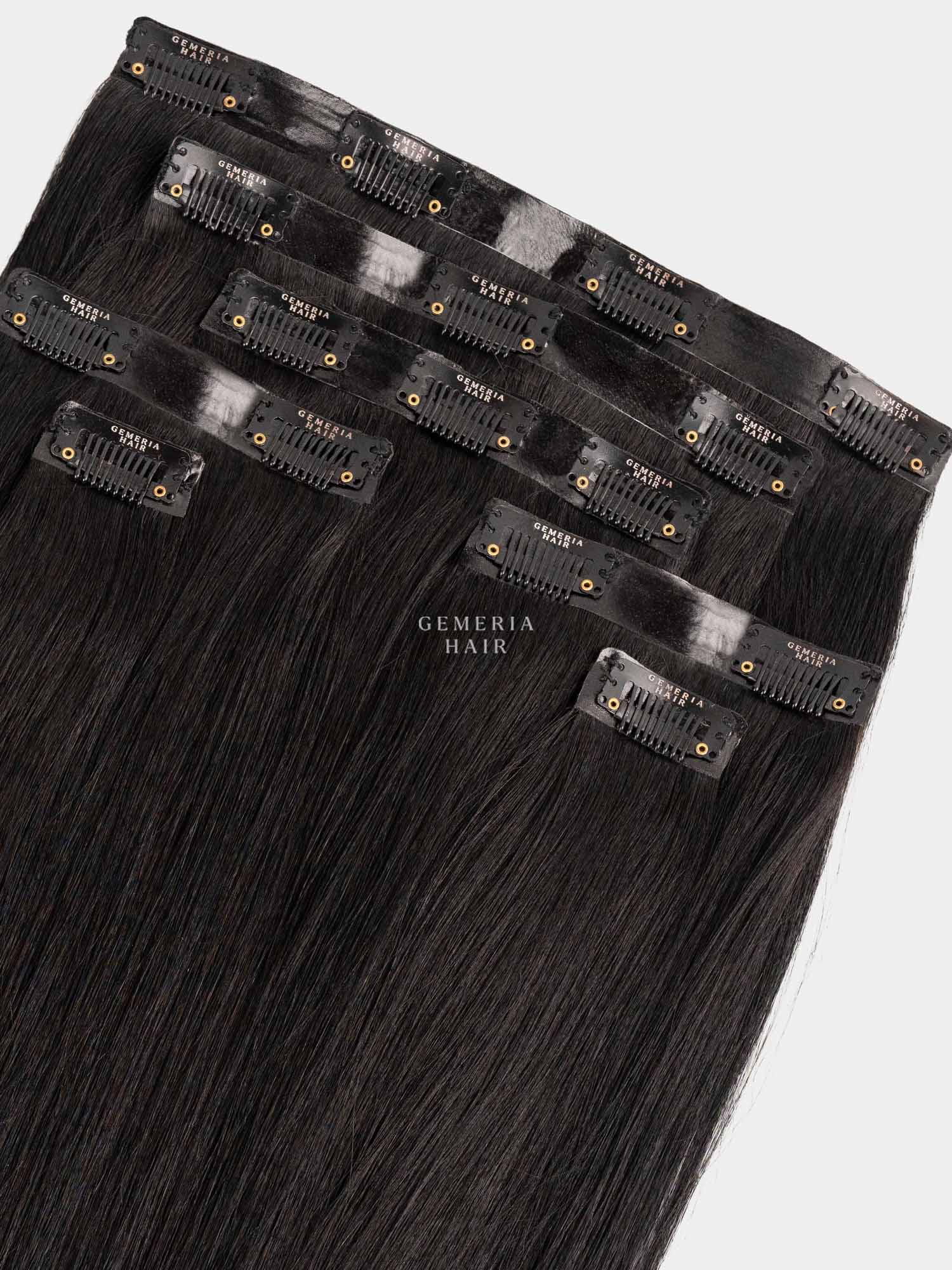 Set of hair extensions with clips on a white background, featuring the brand 'Gemeria Hair'.