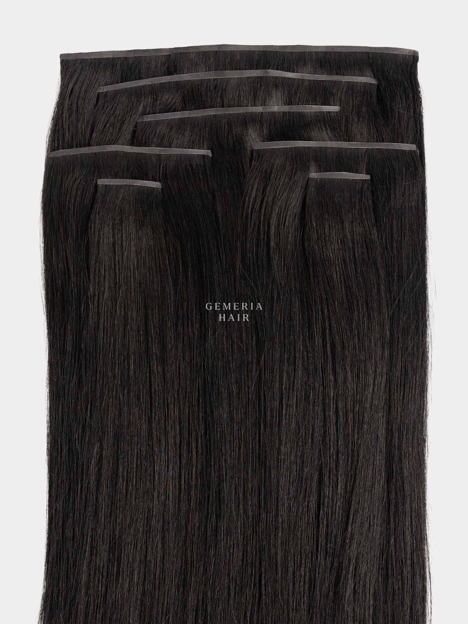 A set of seamless straight clip-in hair extension