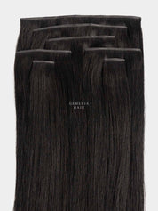 A set of seamless straight clip-in hair extension