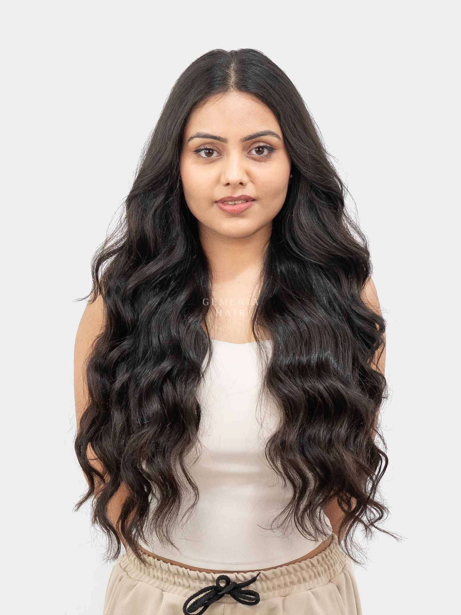 Woman wearing seamless wavy hair extensions