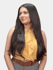 Woman wearing straight clip-in hair extensions from the side