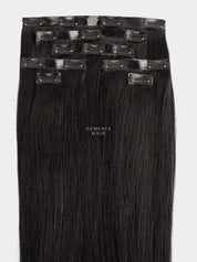 Set of black seamless clip-in hair extensions with clips on a white background, featuring the brand 'Gemeria Hair'.